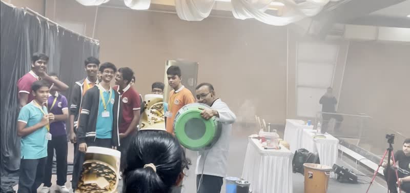 Group of students with the air vortex cannon on stage