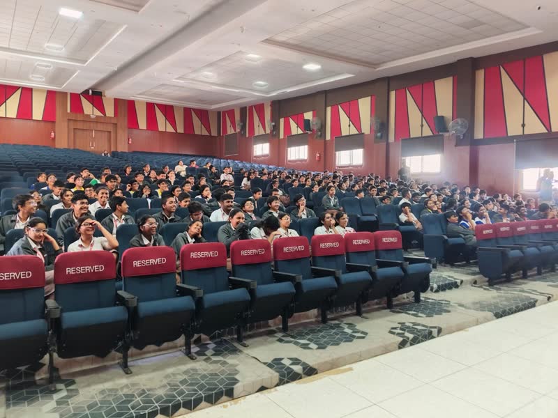 A packed school auditorium watching a Manthan show