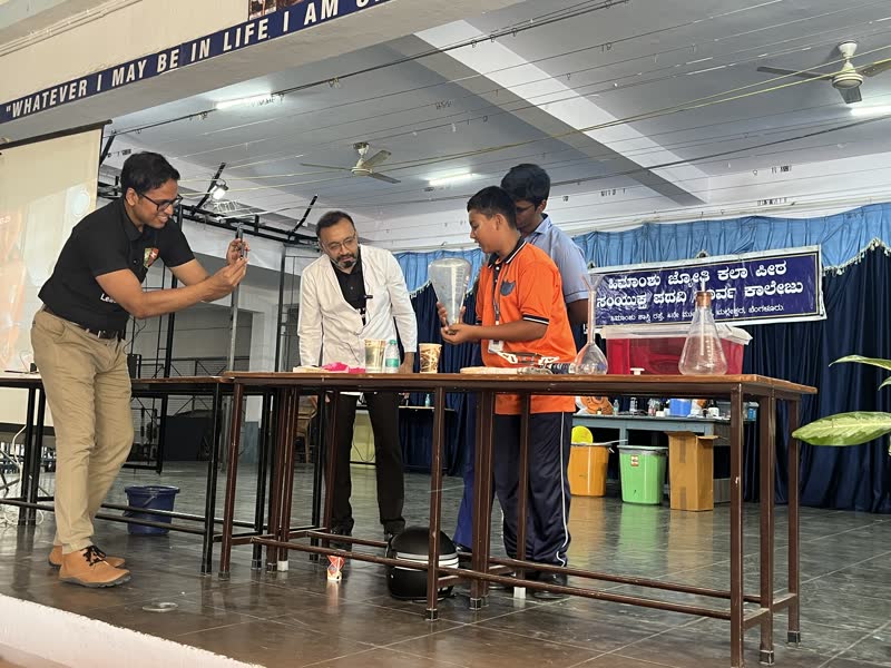 Chemistry experiments on stage with student volunteers