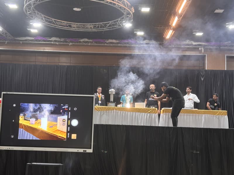 Manthan team performing on stage with smoke effects